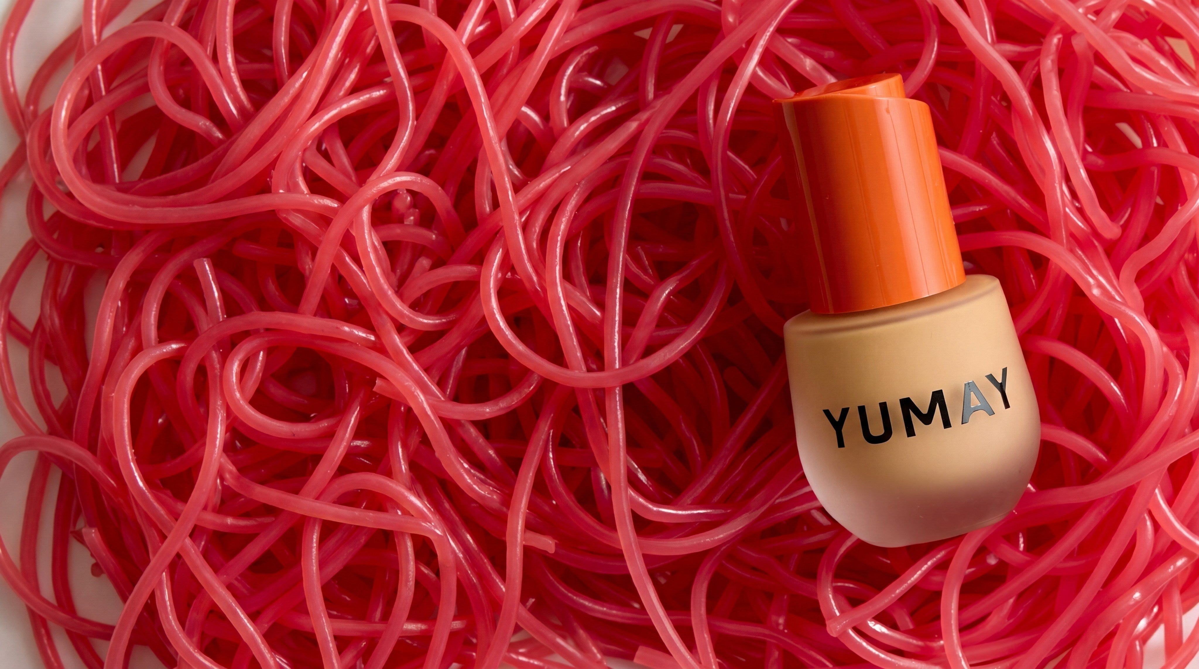 YUMAY Daydream foundation surrounded by pink ribbons